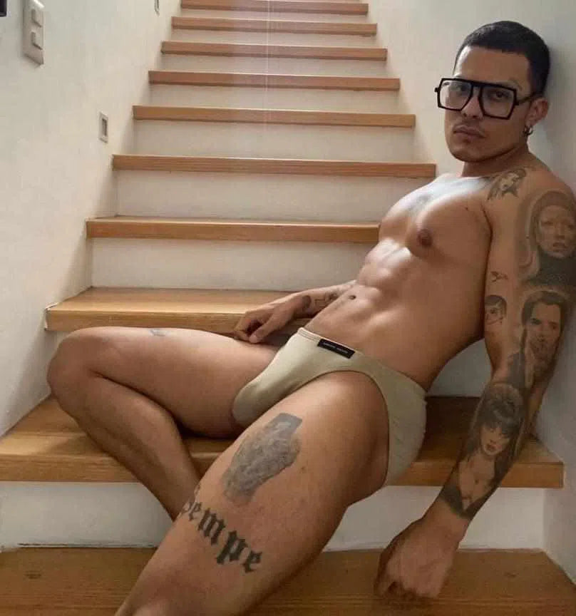 Tattoo man wearing Dominic Albano Collection olive green Tencel bikini brief underwear